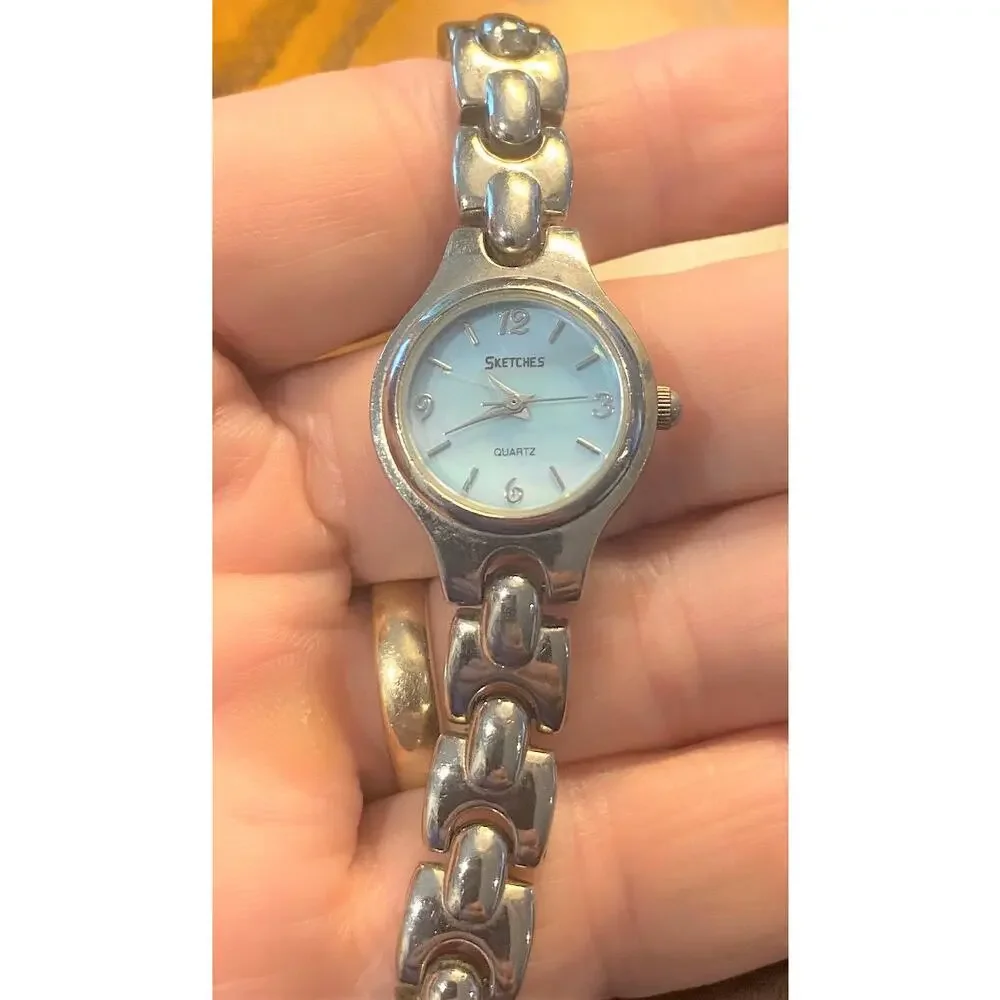 Women's Silver Tone Scketches Watch. Light Blue Face